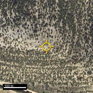 Aerial photograph of El Cueto, pin marked.