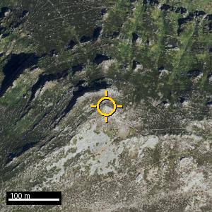 Aerial photograph of Pico Cornón, pin marked.